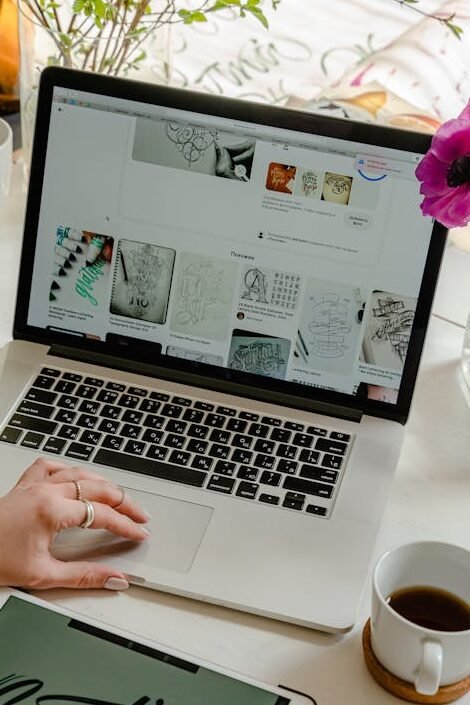 Person Using Macbook Pro on Table